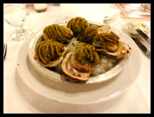 Huitres en coquille a la Rockefeller (Oysters Rockefeller) topped with the original Antoine's Rockefeller sauce. The sauce was created by Antoine's in 1889. 